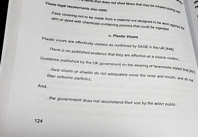 A photo of an open version of the physical book, SARS-CoV-2: Unveiling the COVID-19 Leviathan, showing an excerpt from the section on masking